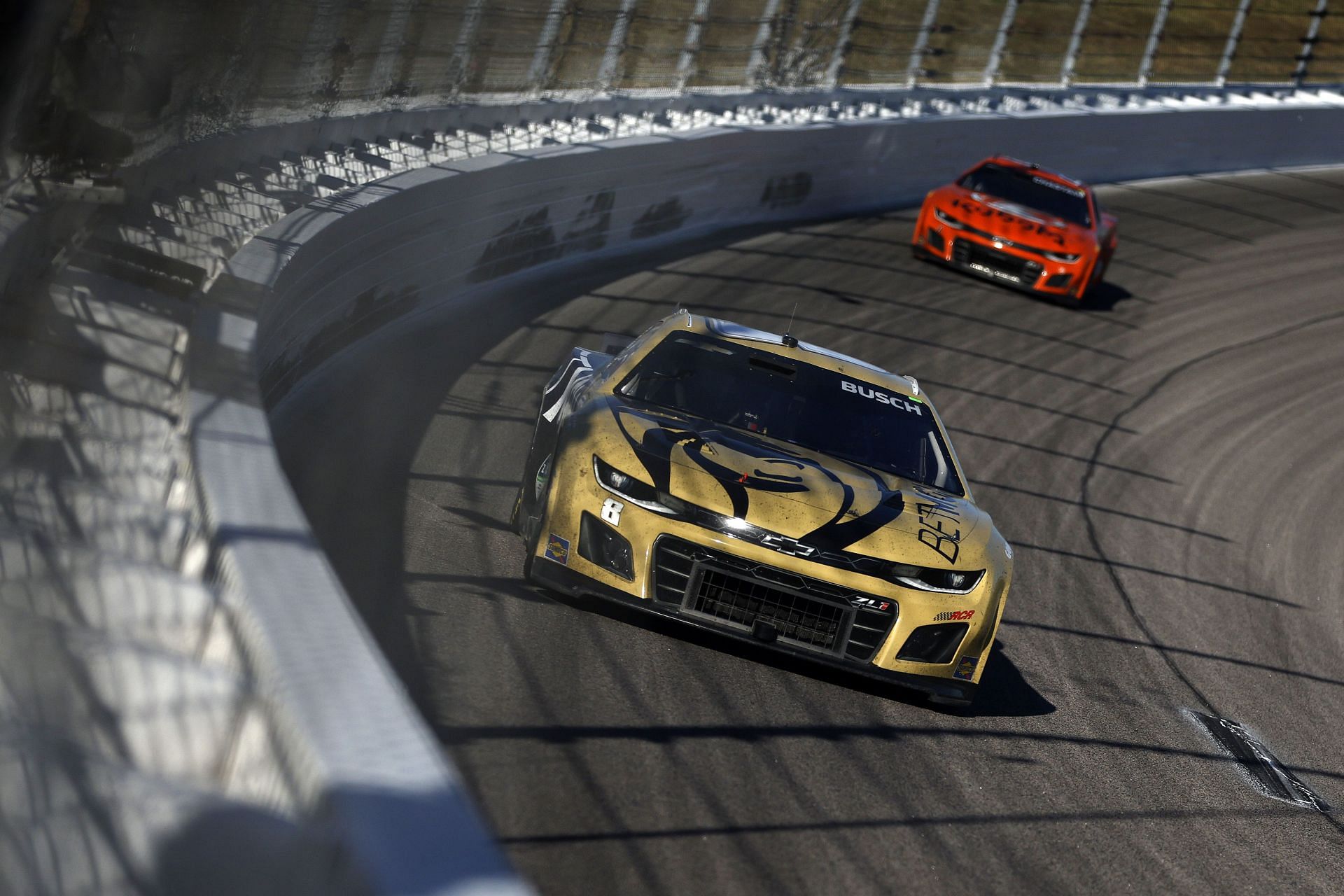 Kyle Busch leading Ross Chastain at Kansas Speedway last year - Source: Getty
